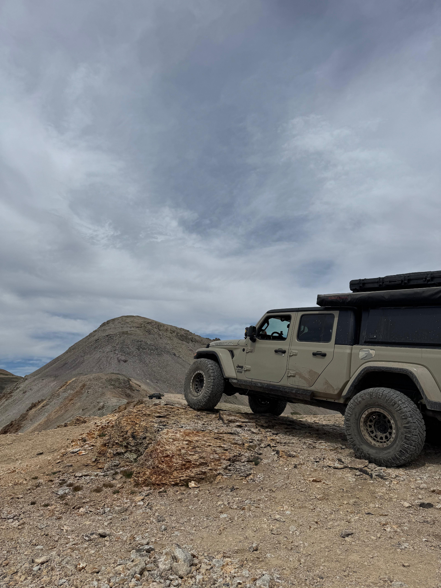 Tan Jeep Gladiator overland build above the treeline