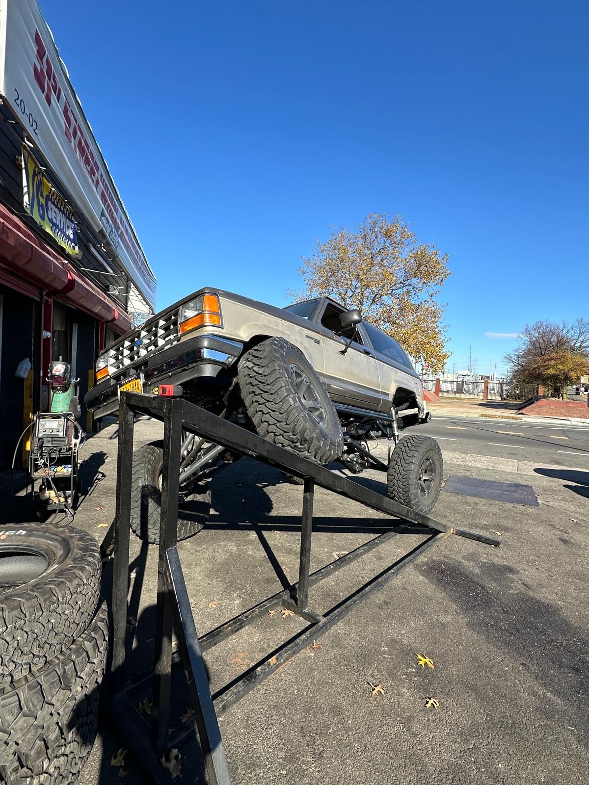 Lifted Bronco II on Fab-Shop's outdoor lift on 31st Street
